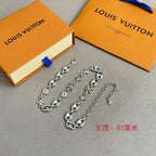 Louis Vuitton silver-tone charm bracelets set with clover and star charm links