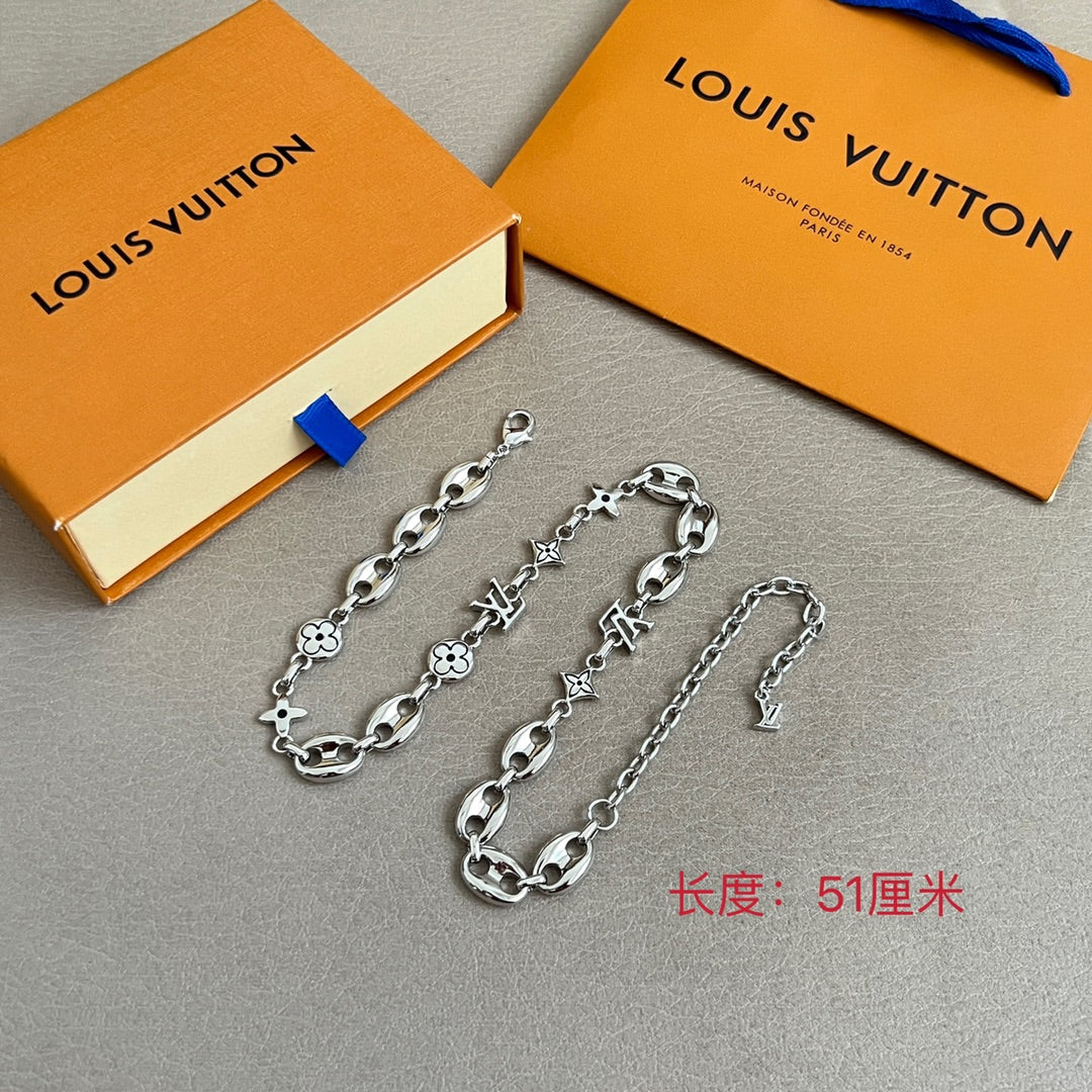 Louis Vuitton silver-tone charm bracelets set with clover and star charm links
