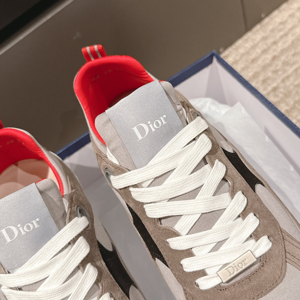 Dior unisex sneakers close-up with white laces, beige tongue, and red-lined collar opening
