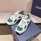 Pair of unisex low-top sneakers, white with teal side panels and white laces