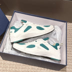 Unisex sneakers in box, white with teal oval panels and textured rubber sole