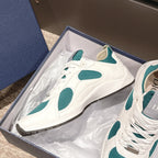 Unisex lace-up sneaker in box, white with teal oval accents and padded collar