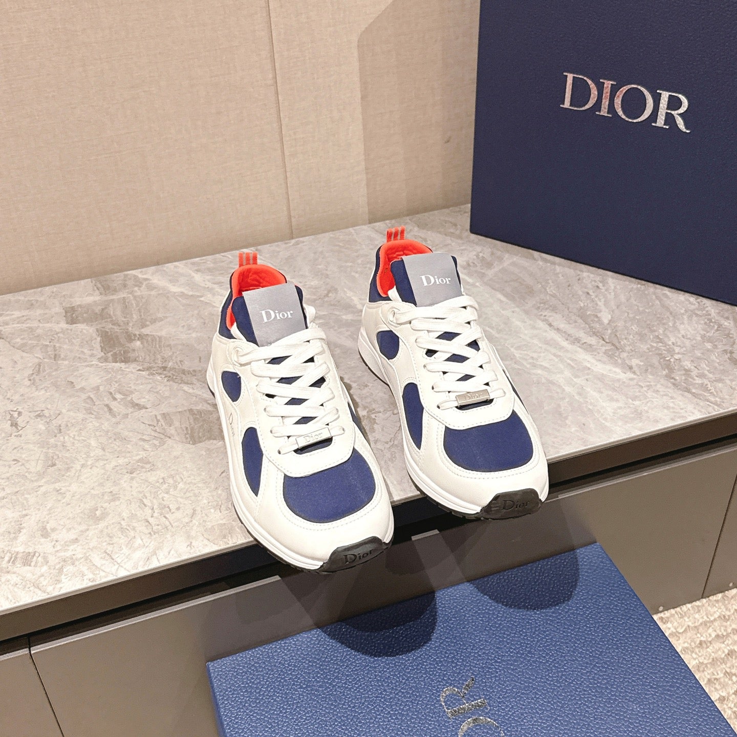Dior unisex sneakers, white with navy oval panels and red heel accents