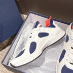 Dior unisex sneakers in box, white with navy patches and bright orange lining