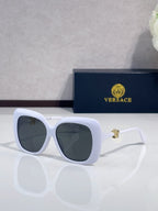Versace sunglasses with white frames and dark gray-tinted lenses