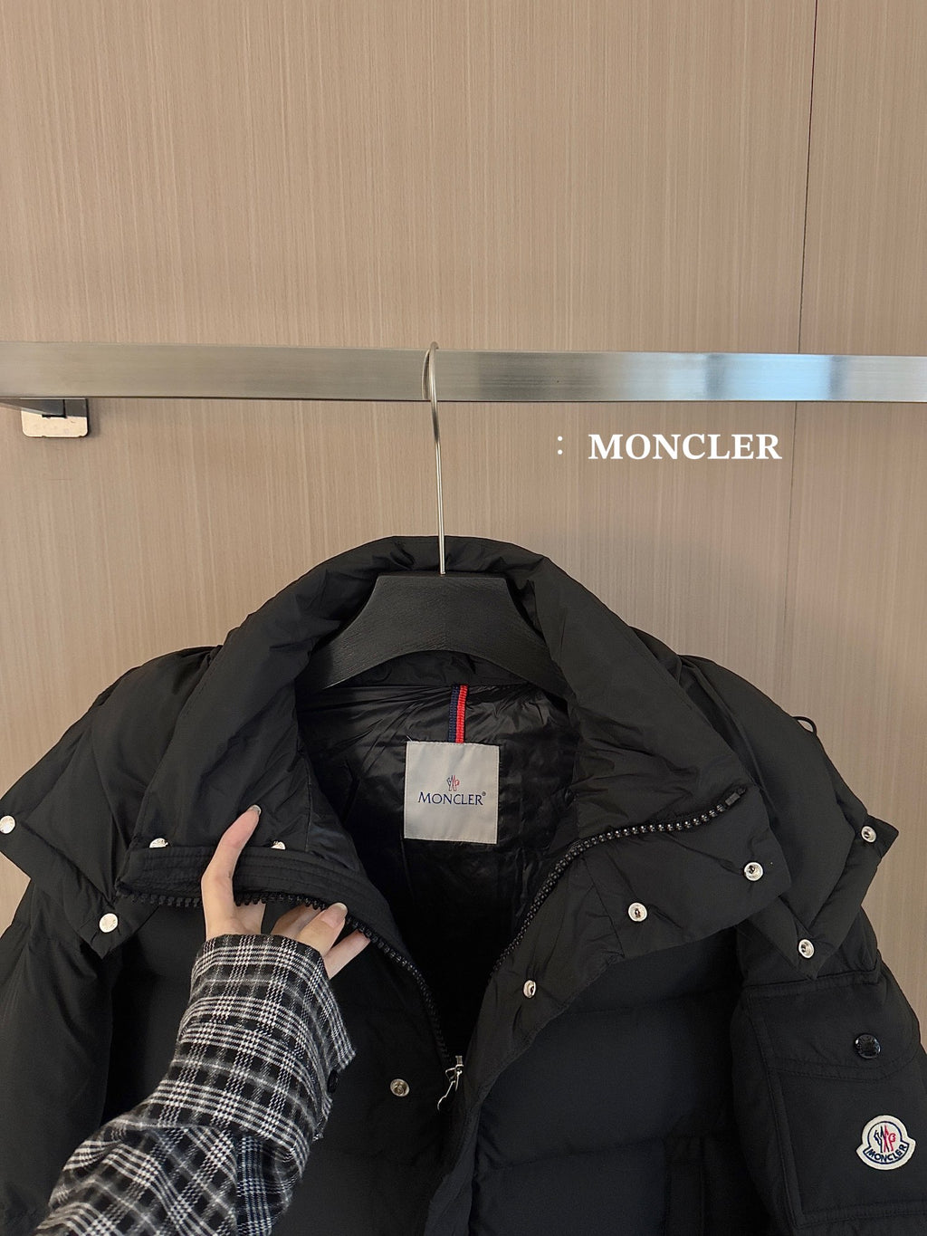Black puffer jacket hood and chest with snap buttons and Moncler chest label
