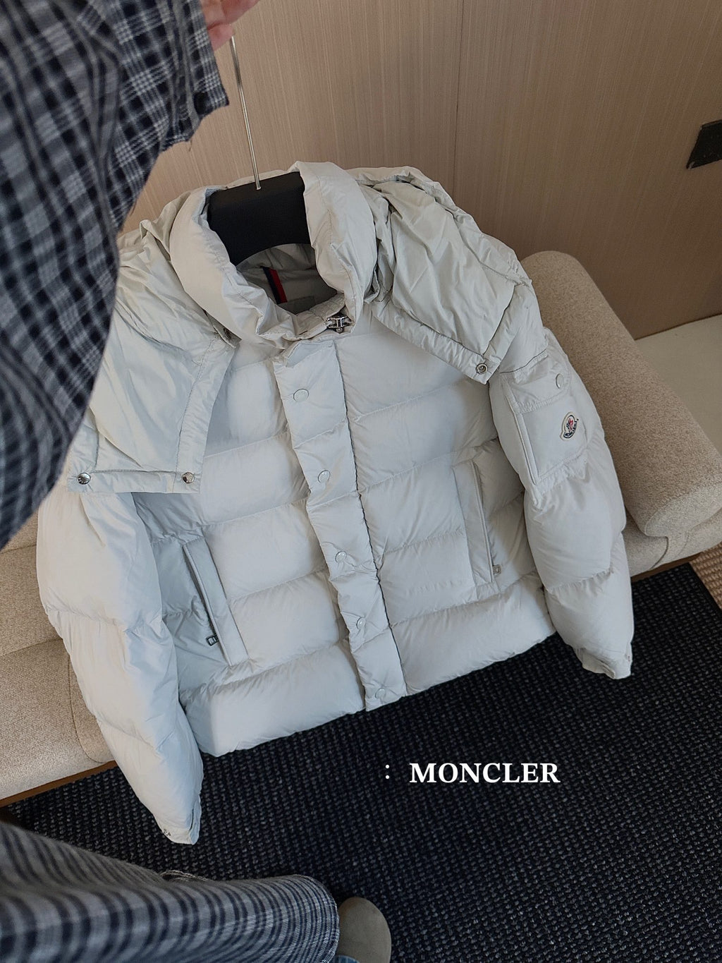 Moncler long white puffer jacket, angled view with hood, zipper and snap front