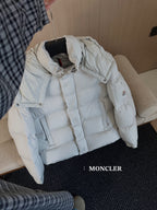 Moncler long white puffer jacket, angled view with hood, zipper and snap front