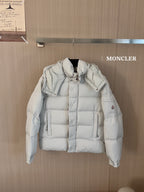 Moncler long white puffer jacket with hood, front snap buttons, and quilted panels