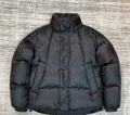 Dior long puffer jacket in dark navy with stand collar and quilted panels