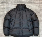 Dior long puffer jacket in dark navy with stand collar and quilted panels