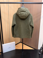 Long puffer jacket in dark olive green, back view with adjustable hood