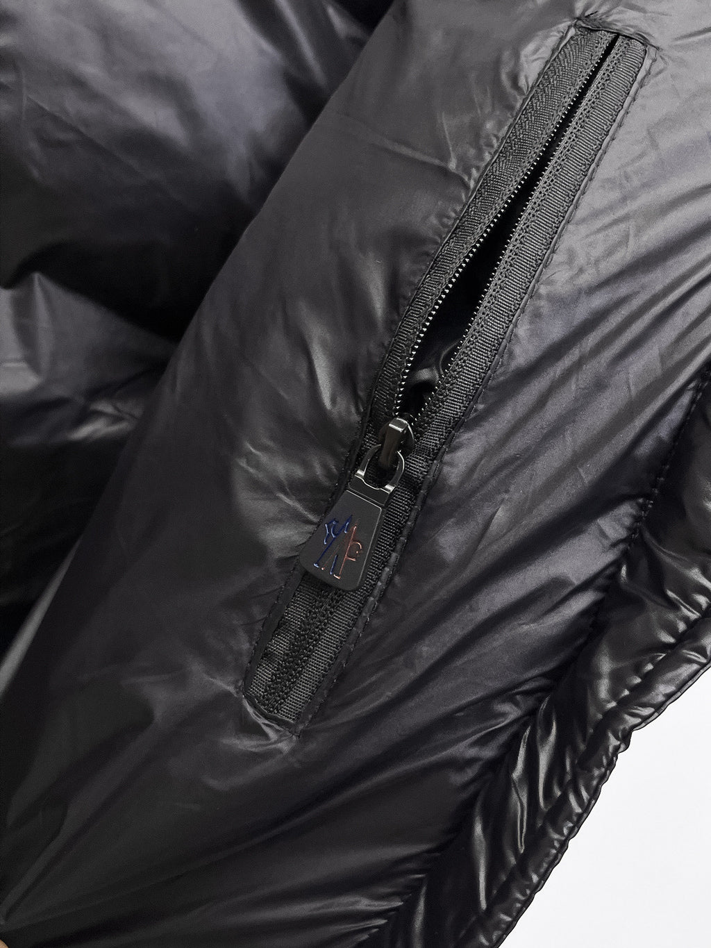 Moncler hooded puffer vest, black side zipper detail on quilted fabric