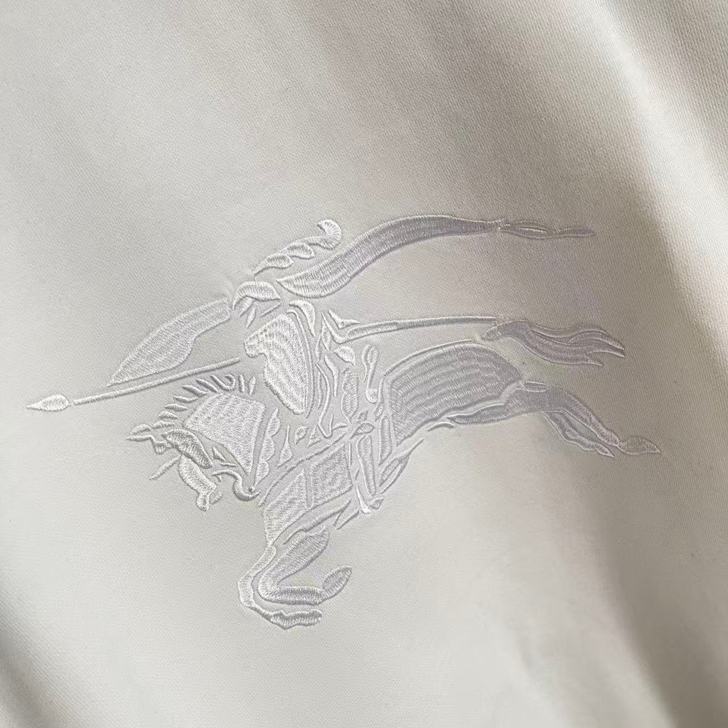 White embroidered horse graphic on Burberry sweatshirt front