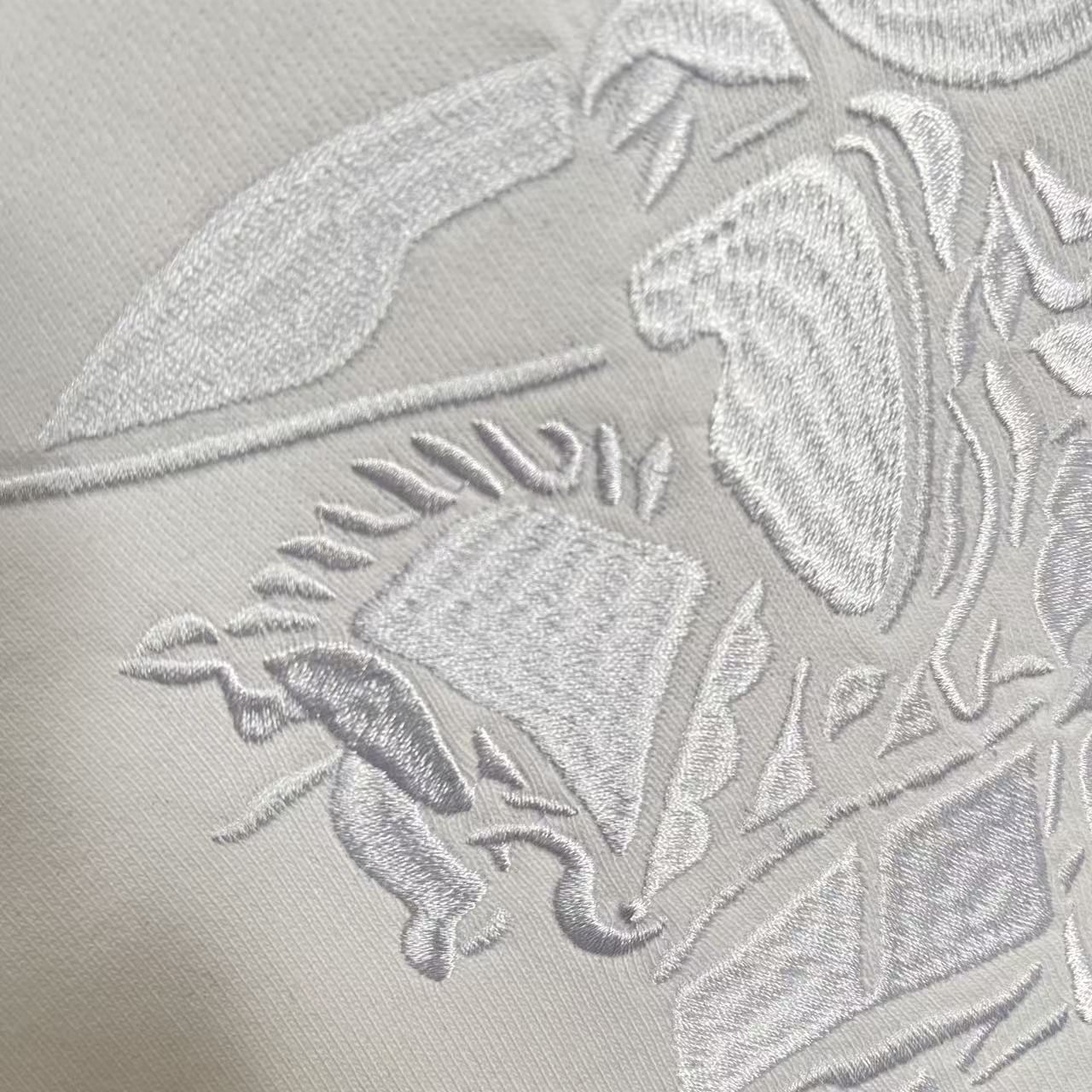 Raised embroidered horse graphic on Burberry sweatshirt fabric