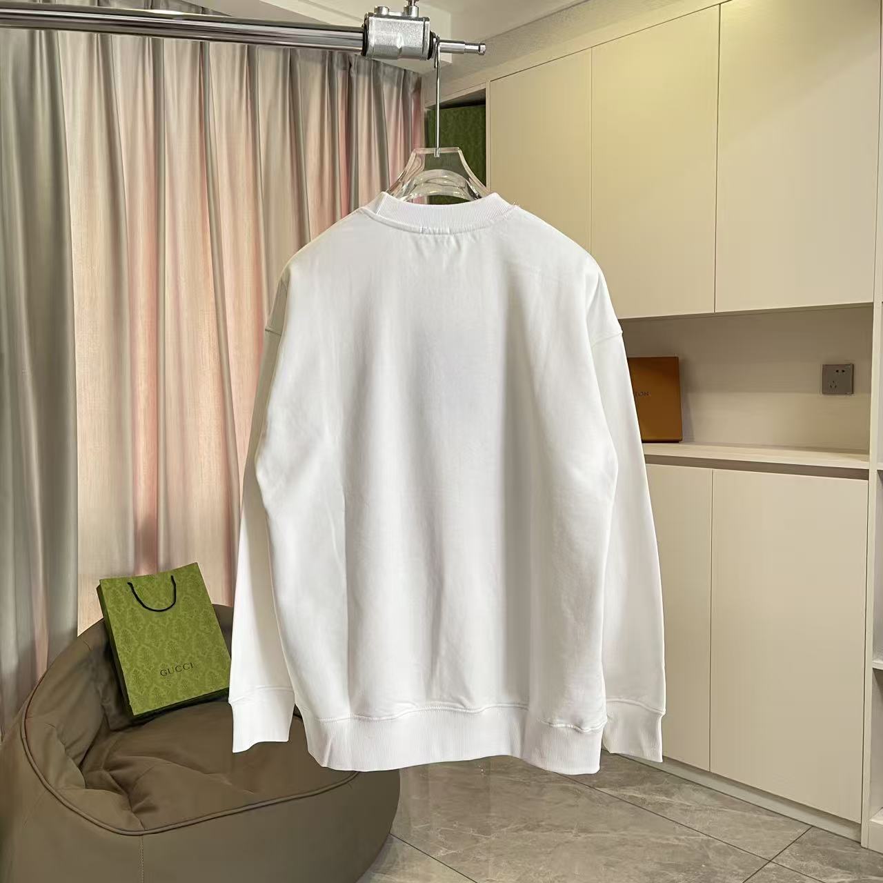 White Burberry crewneck sweatshirt back view with ribbed hem