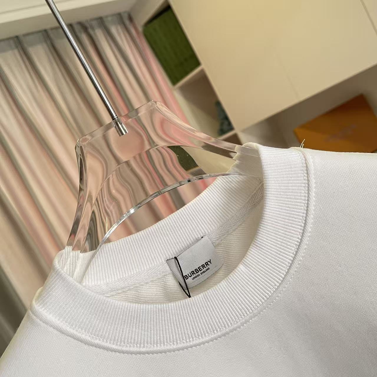 White Burberry sweatshirt with ribbed crew neck and visible brand label