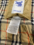 Burberry quilted jacket lining close-up with label and fabric tags on plaid panel