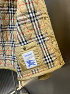 Plaid-lined quilted jacket sleeve cuff with Burberry patch on pocket