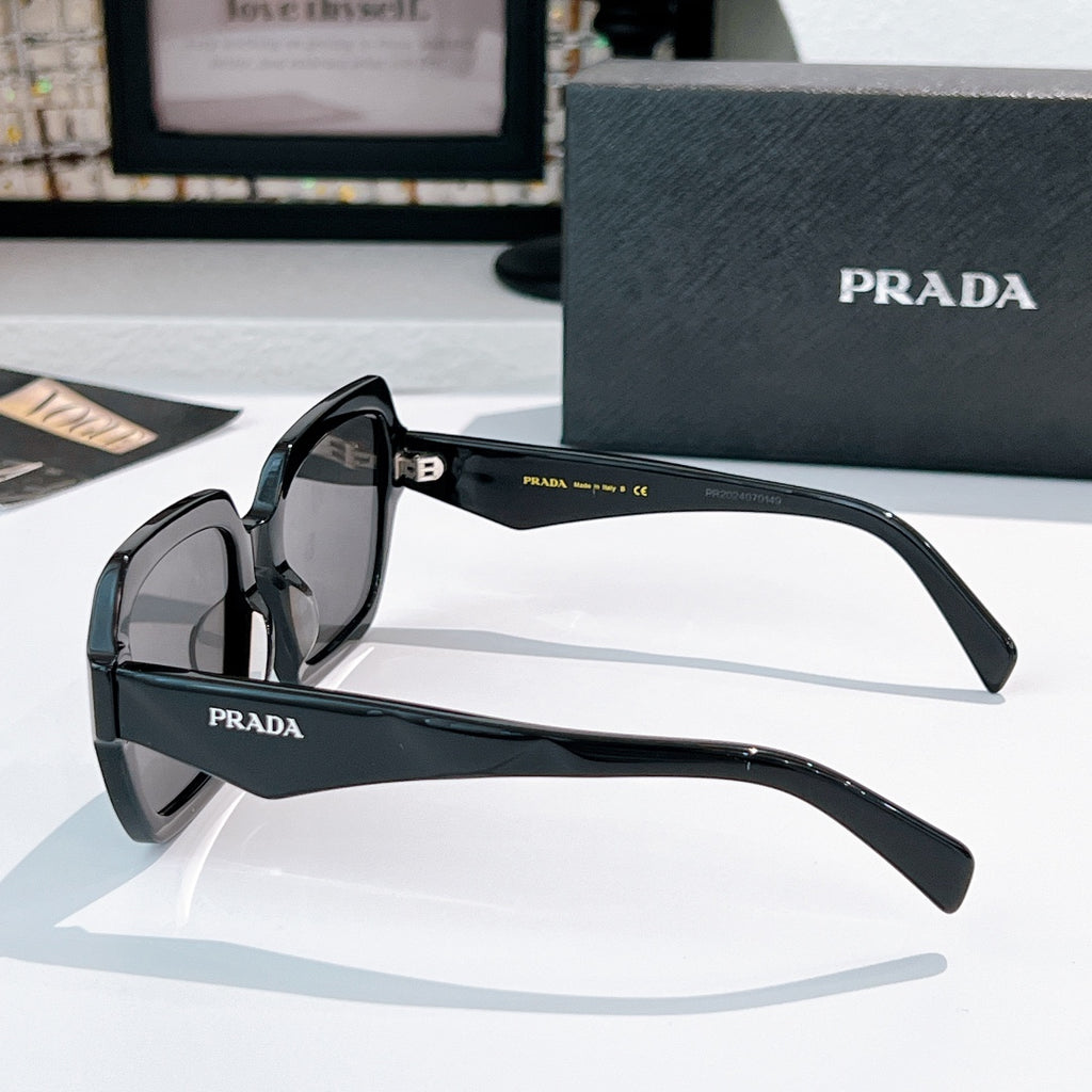 Prada sunglasses black frames with dark lenses, temple detail