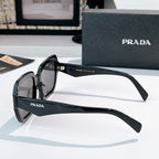 Prada sunglasses black frames with dark lenses, temple detail