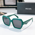 Prada sunglasses with green square frames and dark lenses