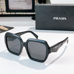 Prada sunglasses with black square frames and gray lenses