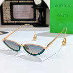 Bottega Veneta cat-eye sunglasses with gold frame and teal tinted lenses