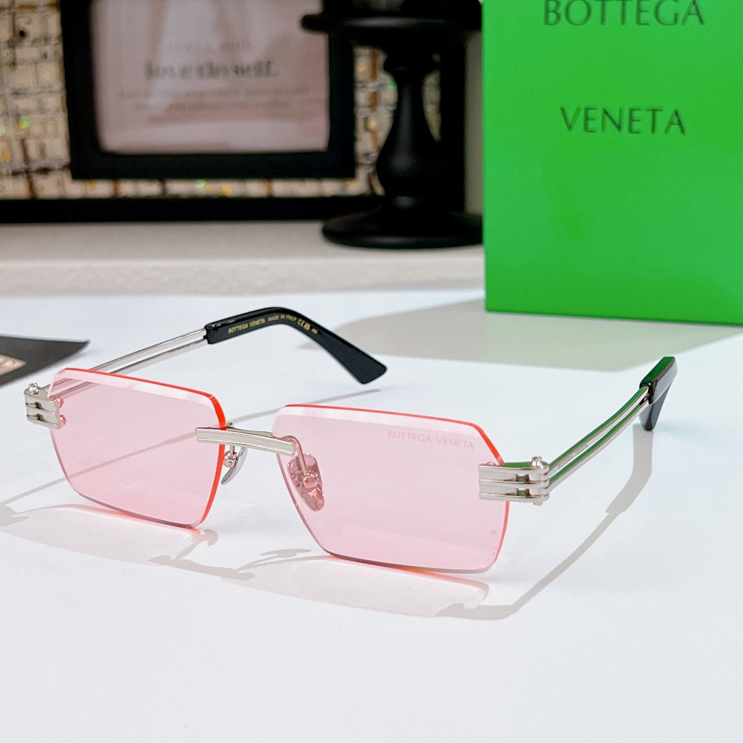 Bottega Veneta sunglasses with pink lenses, pale pink frame, black top bar, green temples