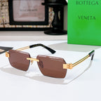 Bottega Veneta sunglasses with brown lenses, gold-tone frame, sculpted temple tips