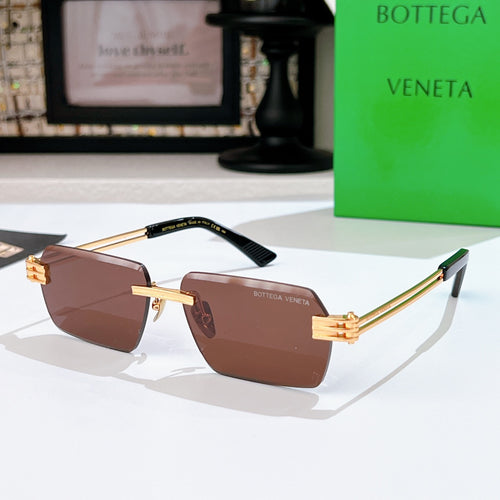 Bottega Veneta sunglasses with brown lenses, gold-tone frame, sculpted temple tips