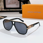 Sunglasses with dark frames and tinted lenses; rhinestone logo detail on temple band