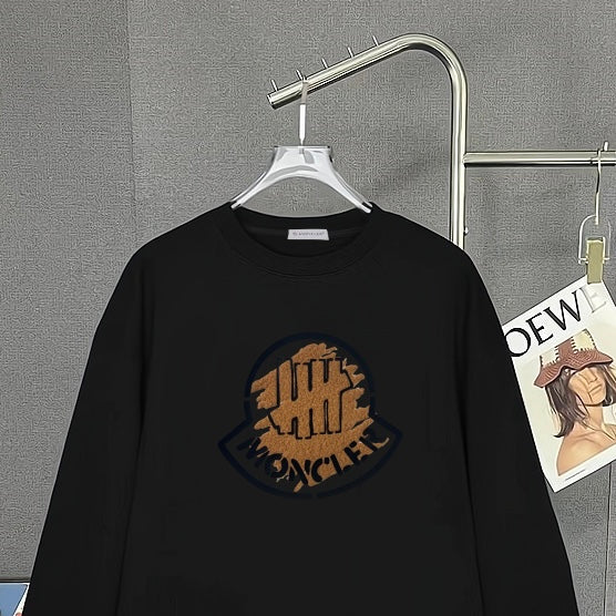 Black Moncler long-sleeve top with chest circular logo graphic and crew neck