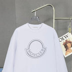 Moncler white long-sleeve sweatshirt with large crest logo detail on chest.