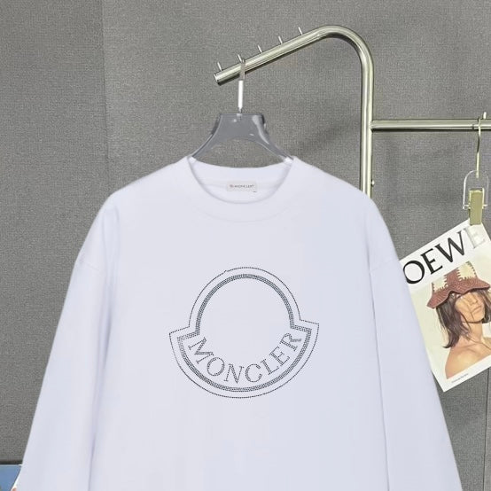 Moncler white long-sleeve sweatshirt with large crest logo detail on chest.