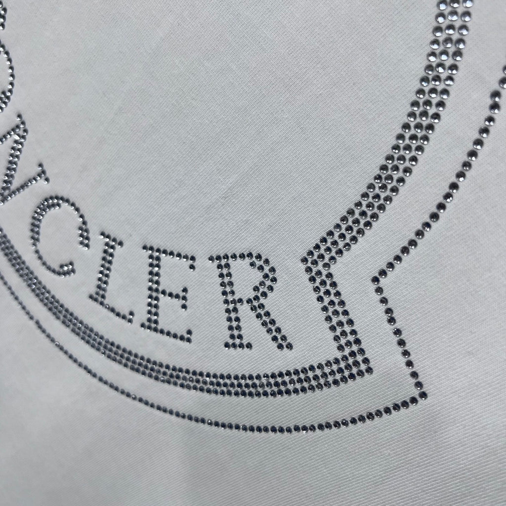 MONCLER wordmark on crest logo, dotted with crystal-like studs.