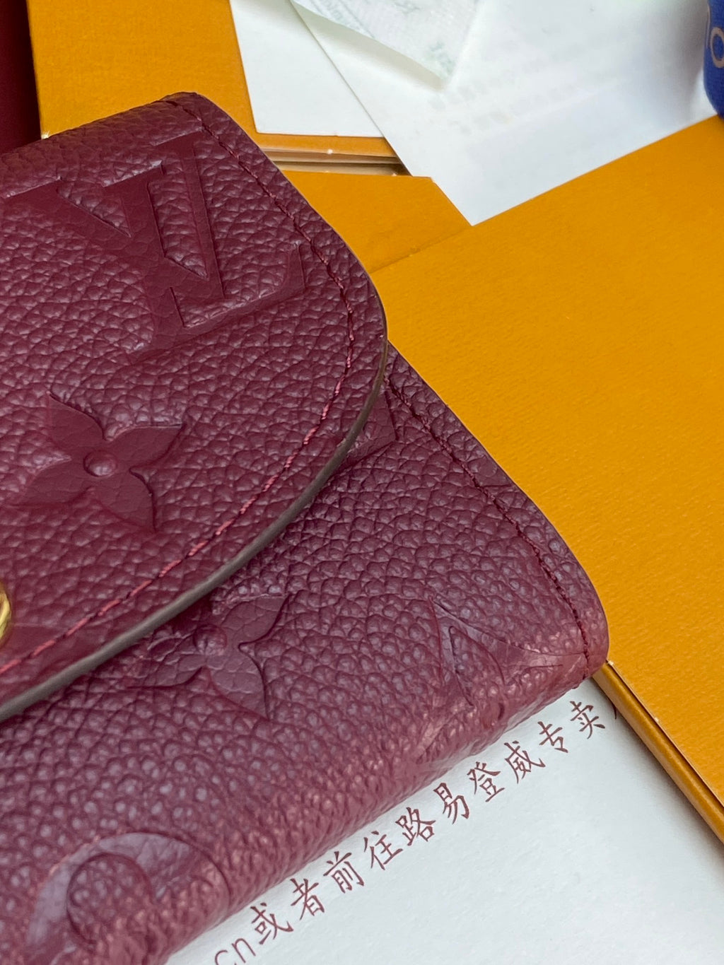 Small Louis Vuitton monogram leather bag, dark plum, textured grain and embossed motifs