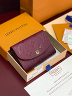 Small Louis Vuitton monogram bag in dark plum leather with flap and gold snap closure