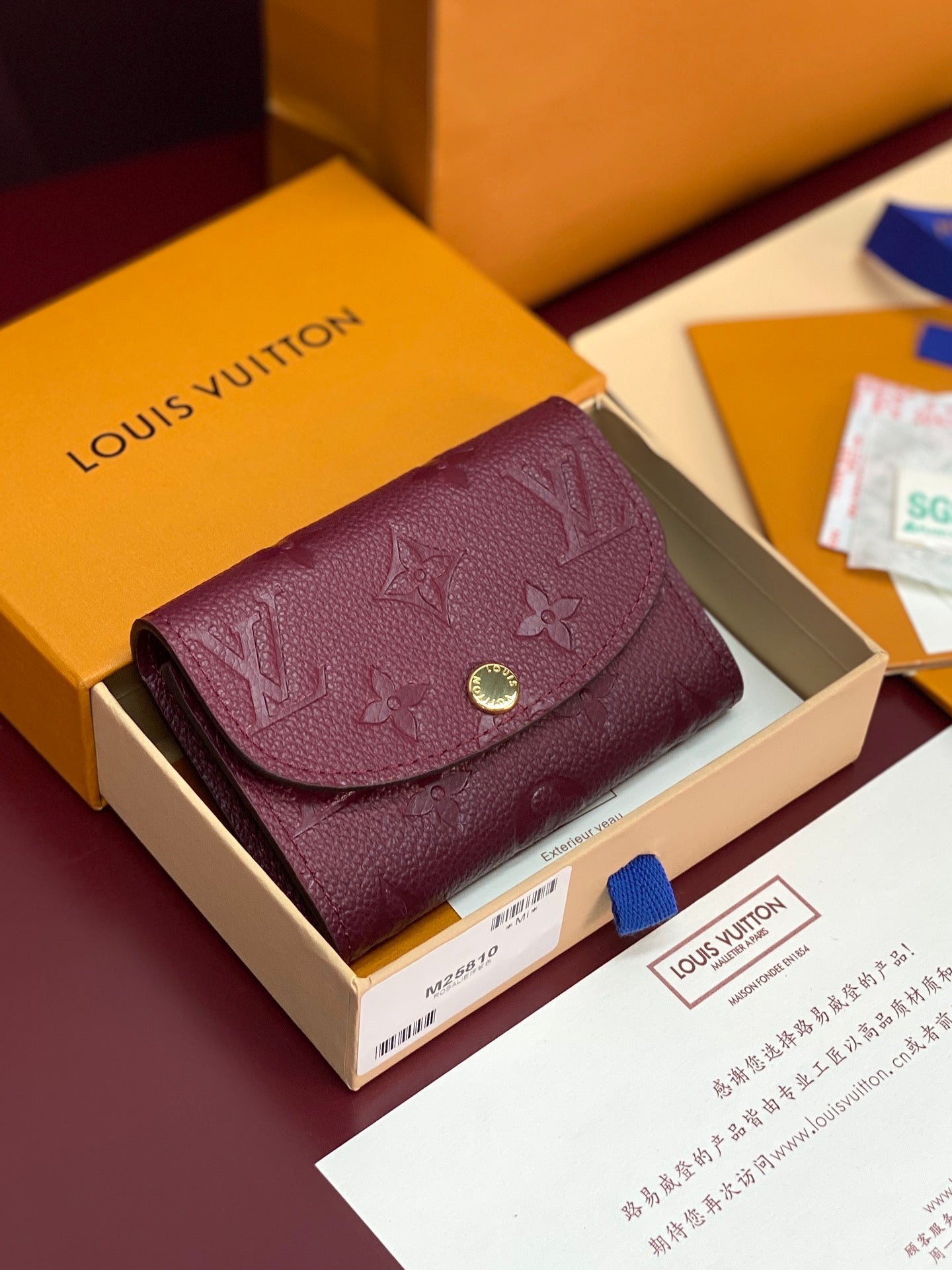 Small Louis Vuitton monogram bag in dark plum leather with flap and gold snap closure