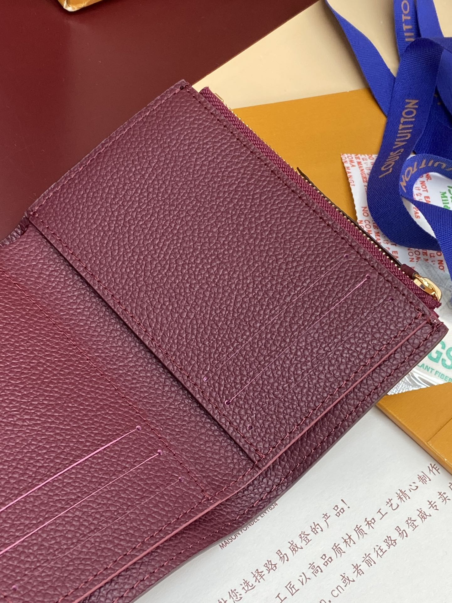 Louis Vuitton small shoulder bag in burgundy textured leather with flap and stitching