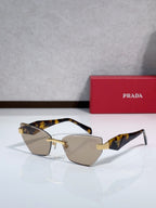 Cat-eye sunglasses with tortoise-pattern temples and gold-tone metal frame, brown tint lenses