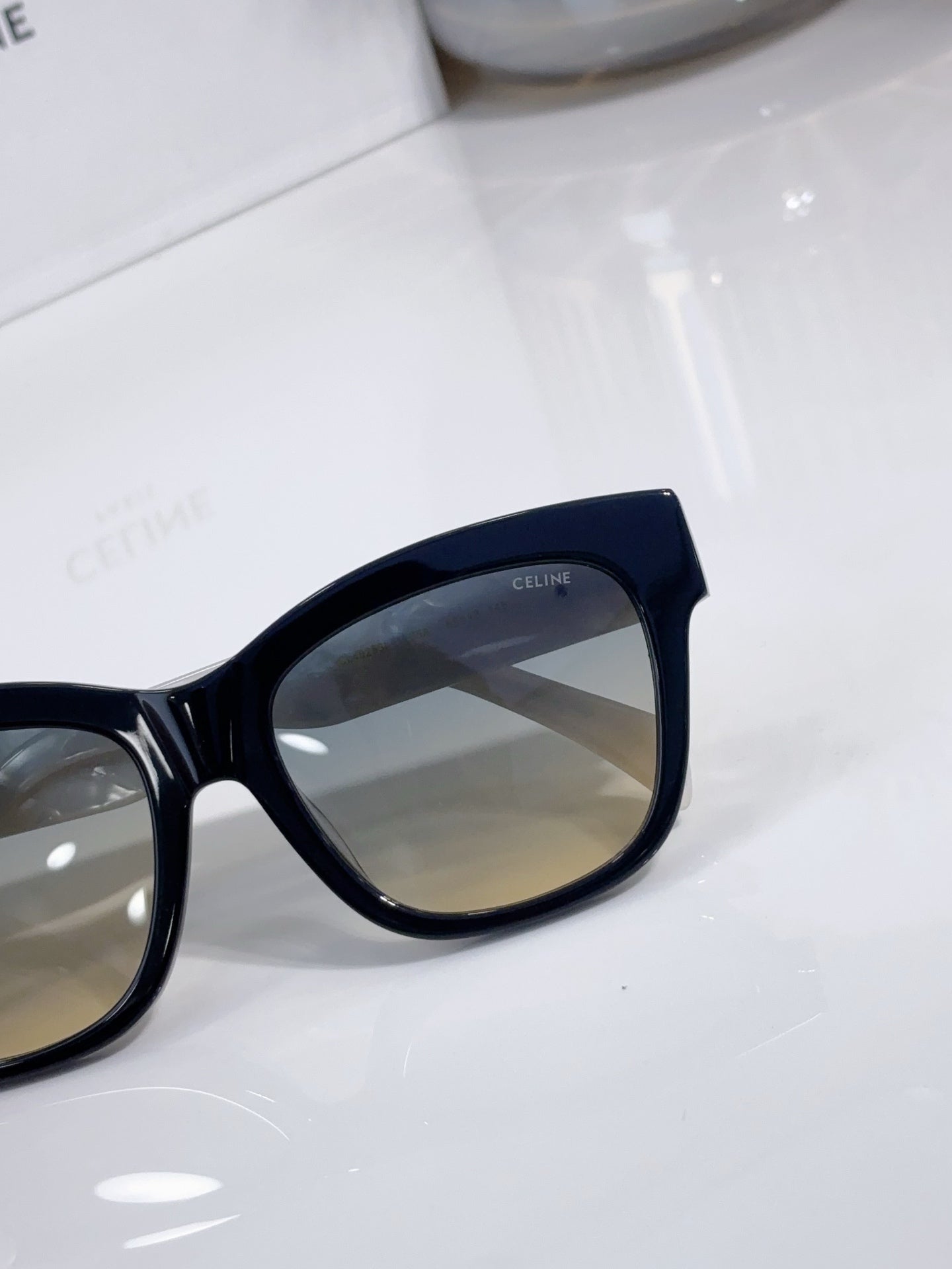 Cat-eye sunglasses close-up with dark frame and tinted lens