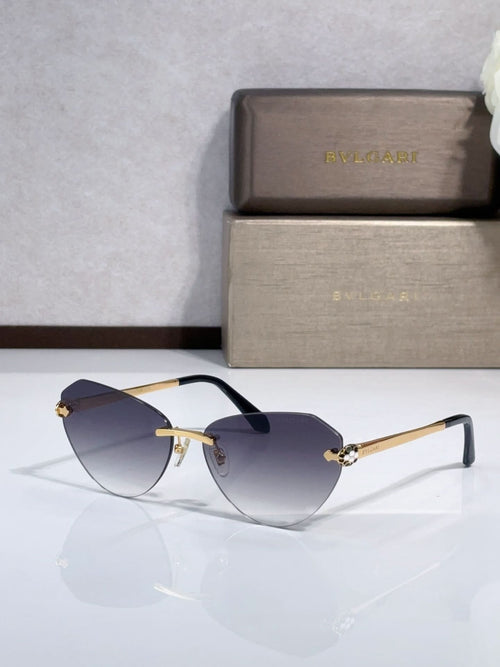 Bvlgari sunglasses with dark blue gradient lenses, gold metal frame, black temples