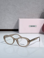 MiuMiu glasses with taupe round frames and clear lenses