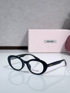MiuMiu glasses with navy round frames and clear lenses
