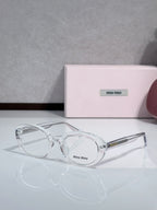 MiuMiu glasses with clear round frames and clear lenses