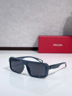 Prada sunglasses with dark navy frame and large dark lenses, side profile