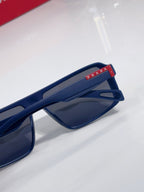 Prada sunglasses close-up of navy temple with Prada logo patch