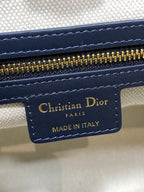 Christian Dior Paris label reading 'Made in Italy' on beige leather patch