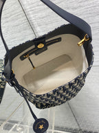 Interior of Dior Oblique crossbody bag with beige lining and zip pocket